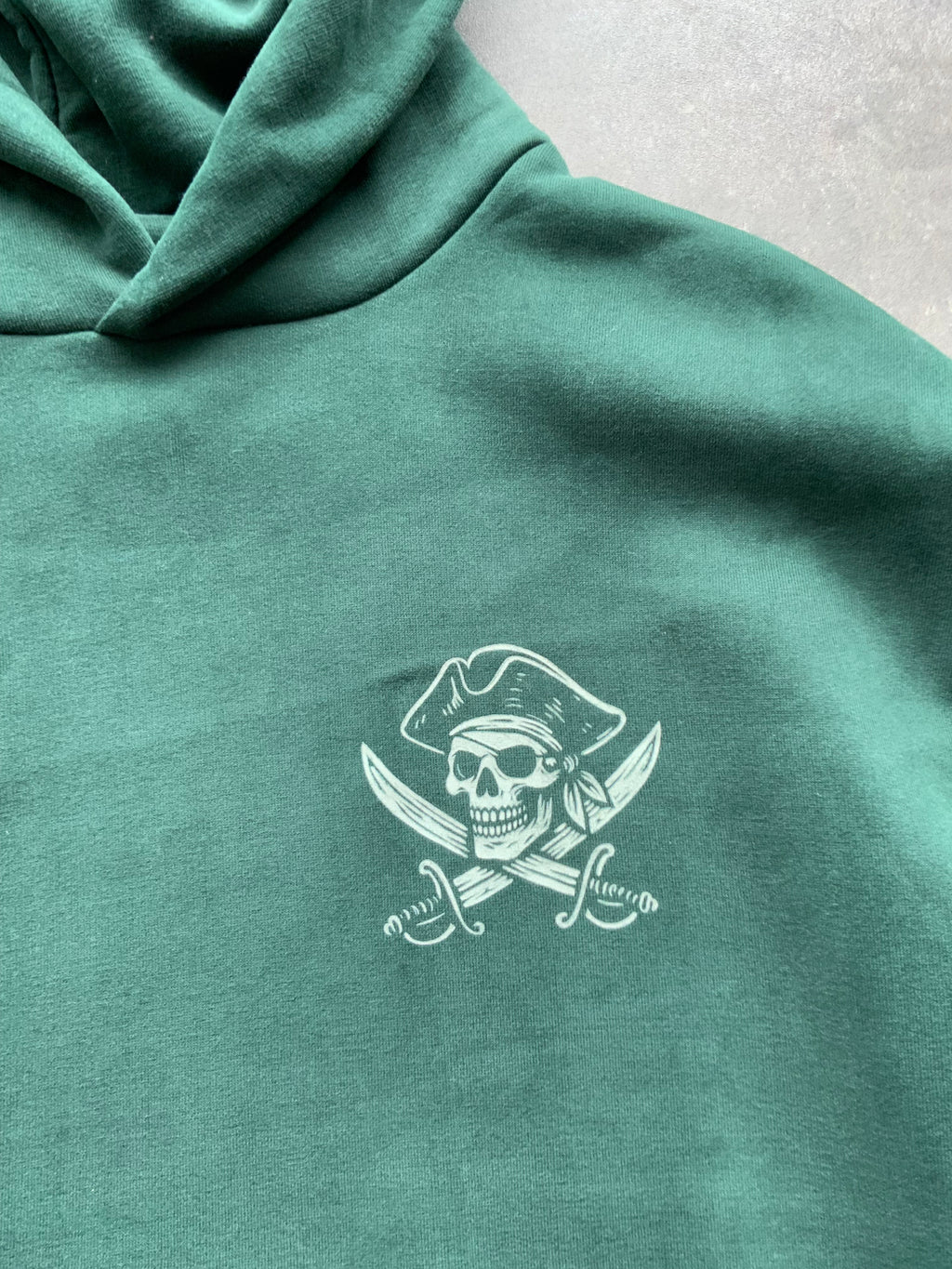 Skullduggery Scoundrels Hoodie in bottle green