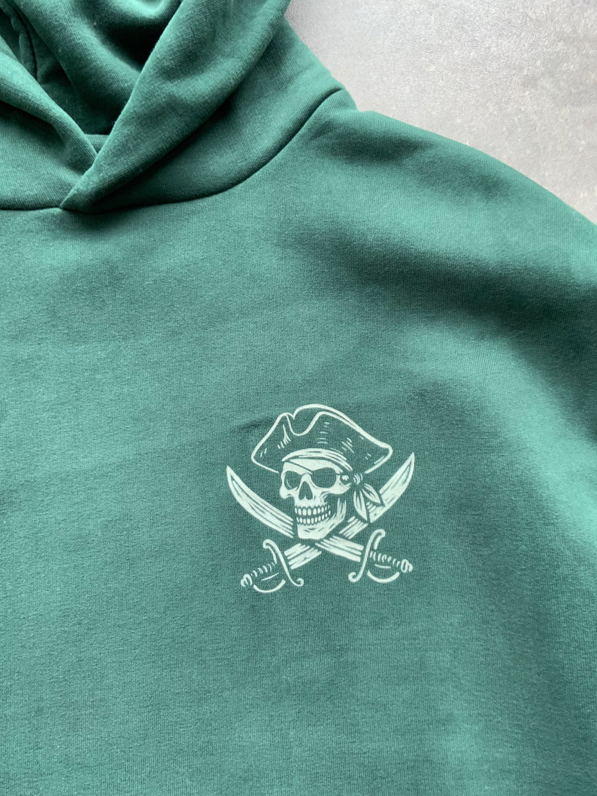 Skullduggery Scoundrels Hoodie in bottle green